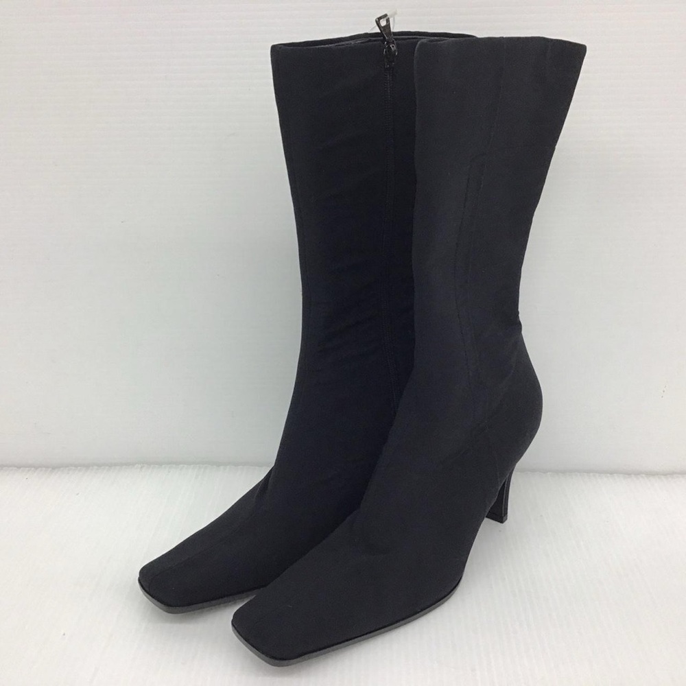 Black nylon Prada heeled boots.